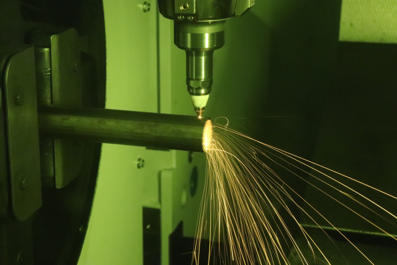 Close up of a laser tube cutting machine cutting a tube