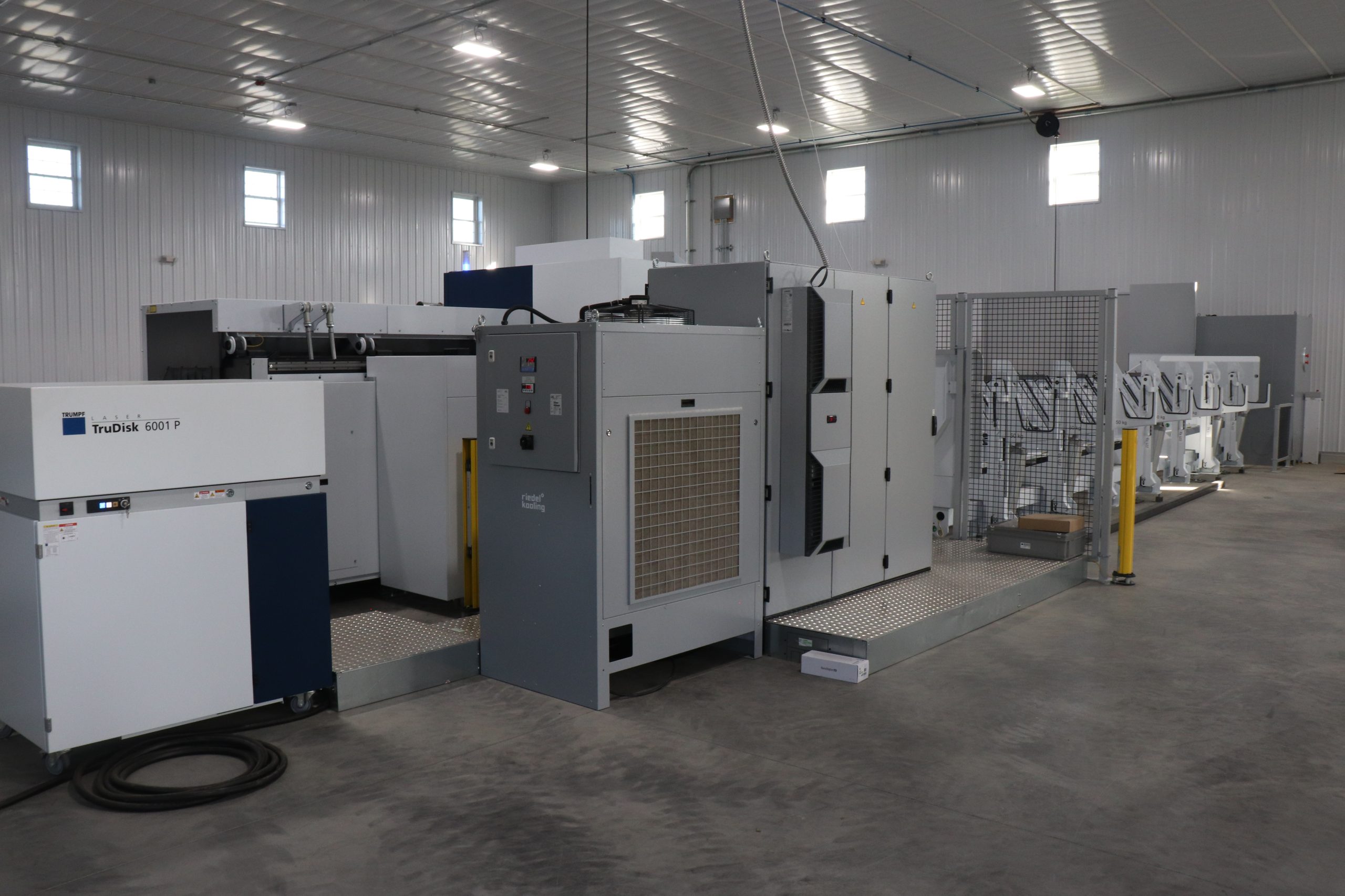 Interior of a warehouse with a laser tube cutter