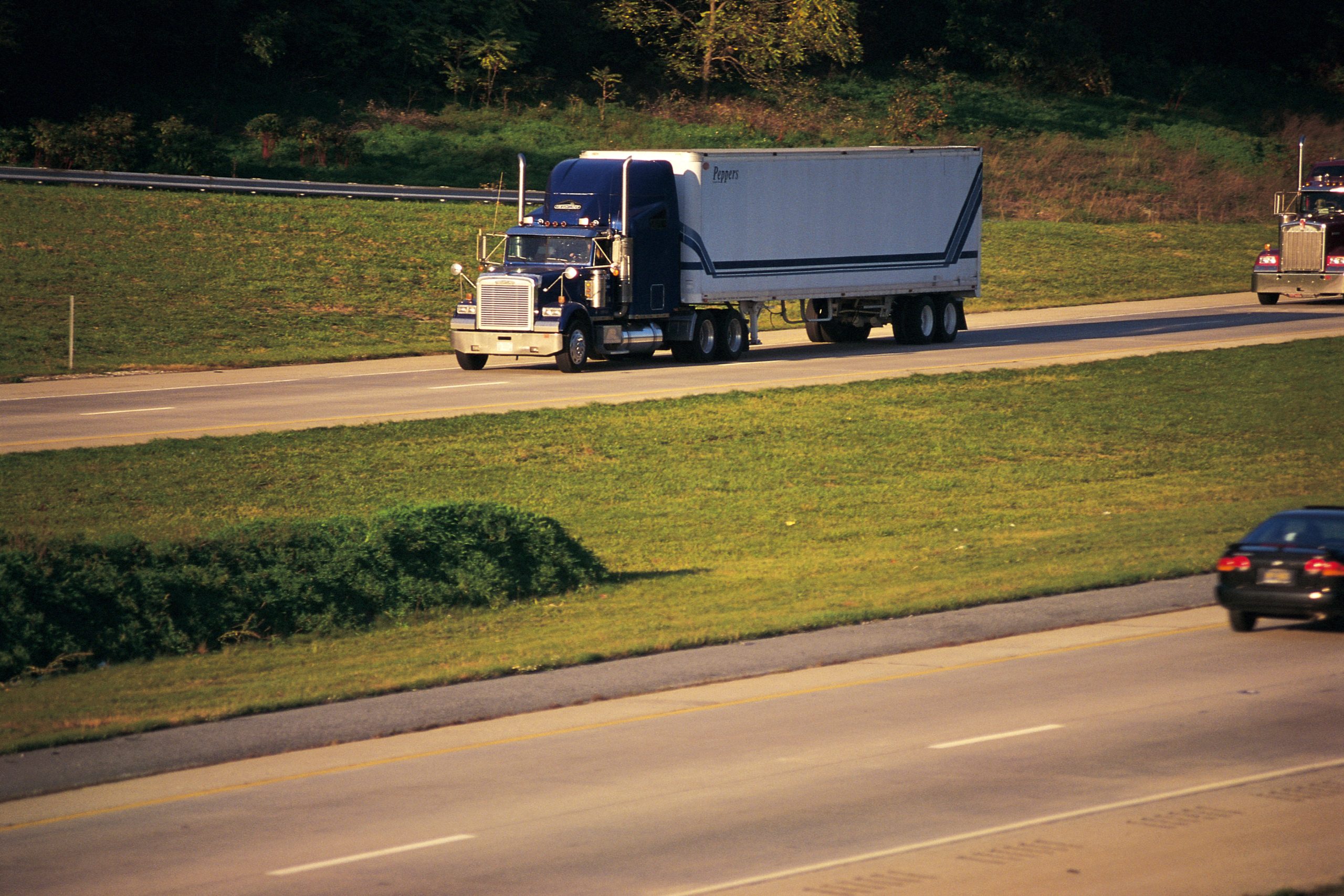 Semi truck with trailer on highway