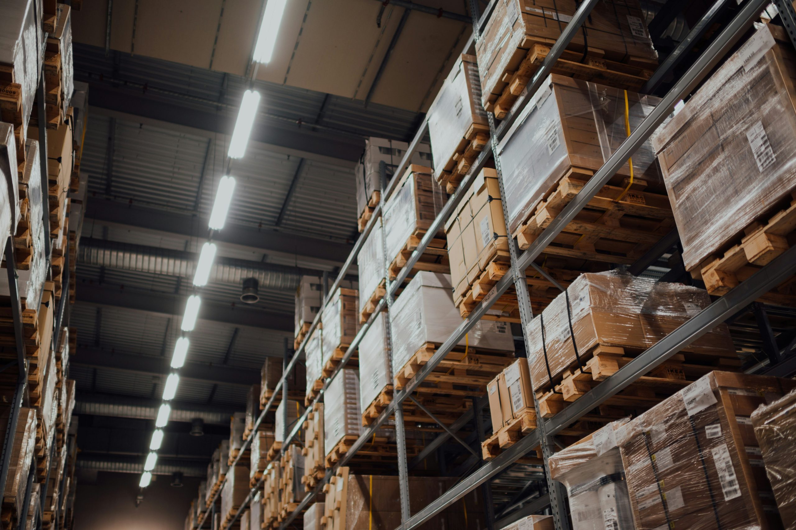 Shelves full of wrapped boxes on pallets.