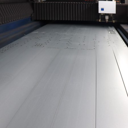 Looking in the window of a laser cutter in action
