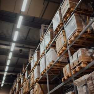 Shelves full of wrapped boxes on pallets.